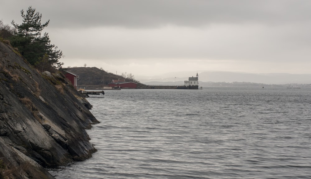 a body of water with a building in the distance