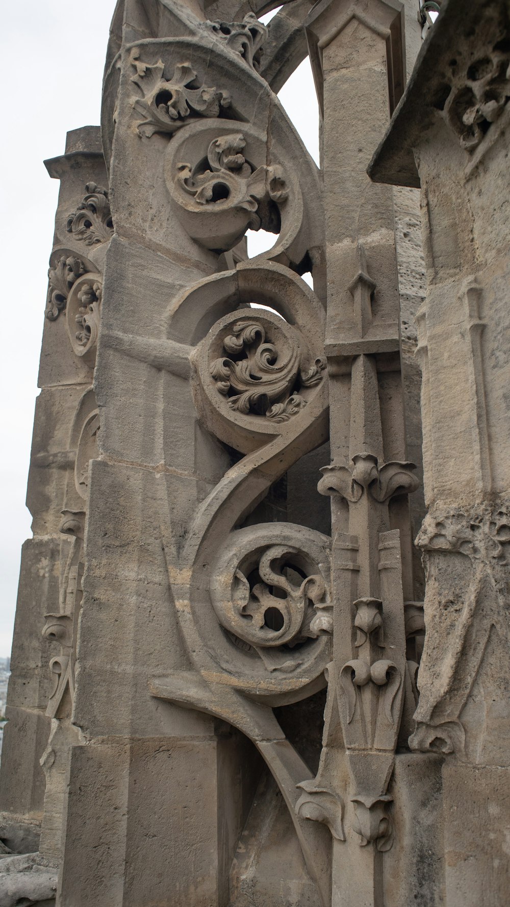 a stone sculpture of a man and a woman