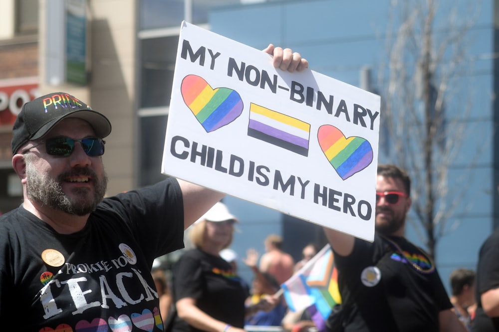 a man holding a sign