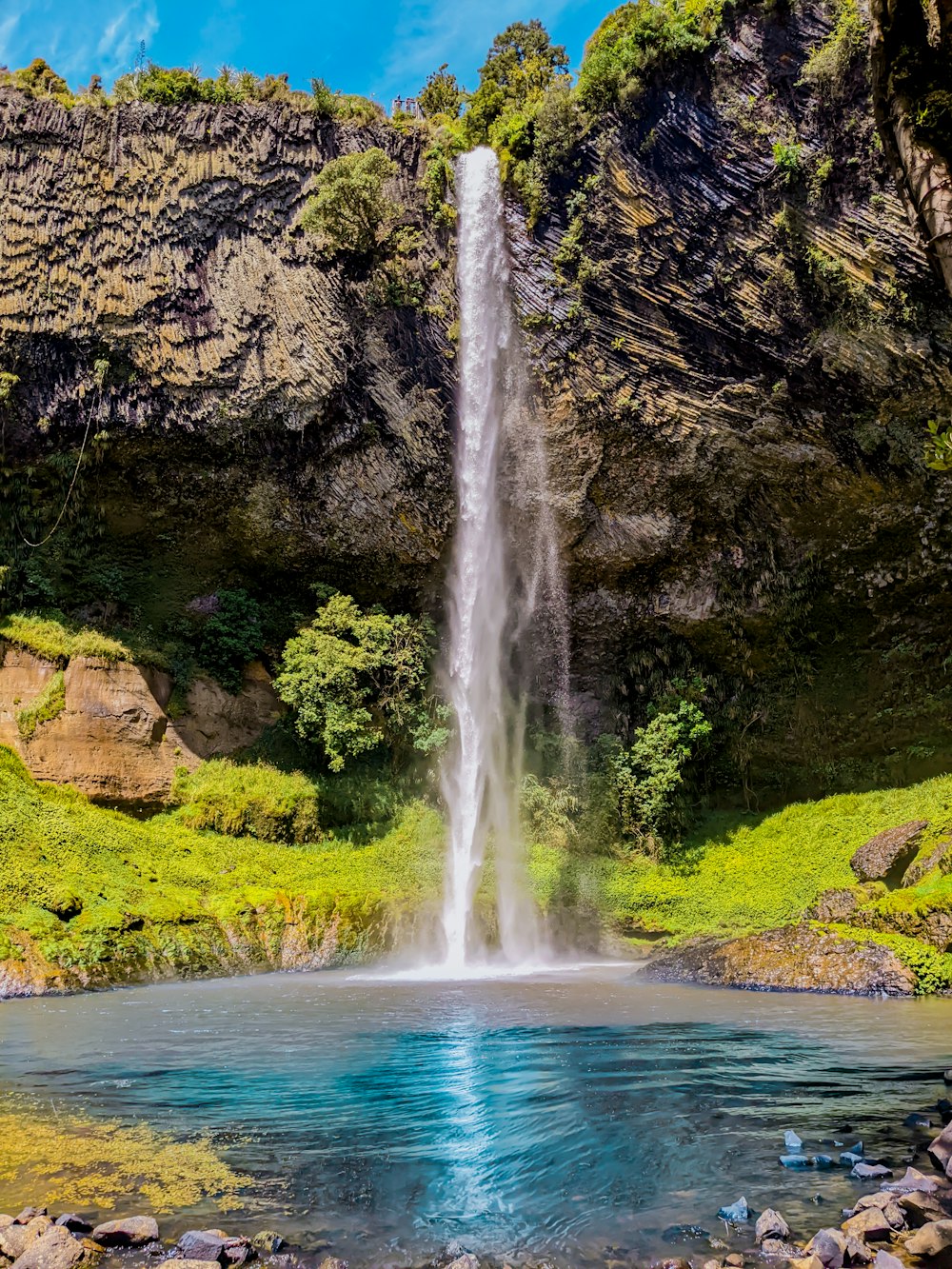 a waterfall in a rocky area