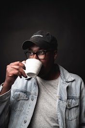 a man drinking from a cup