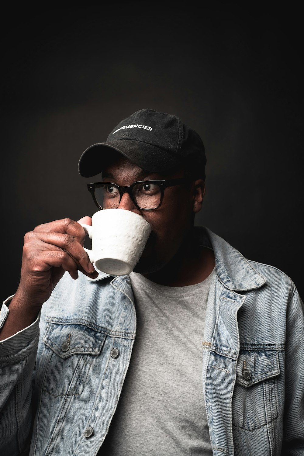 a man drinking from a cup