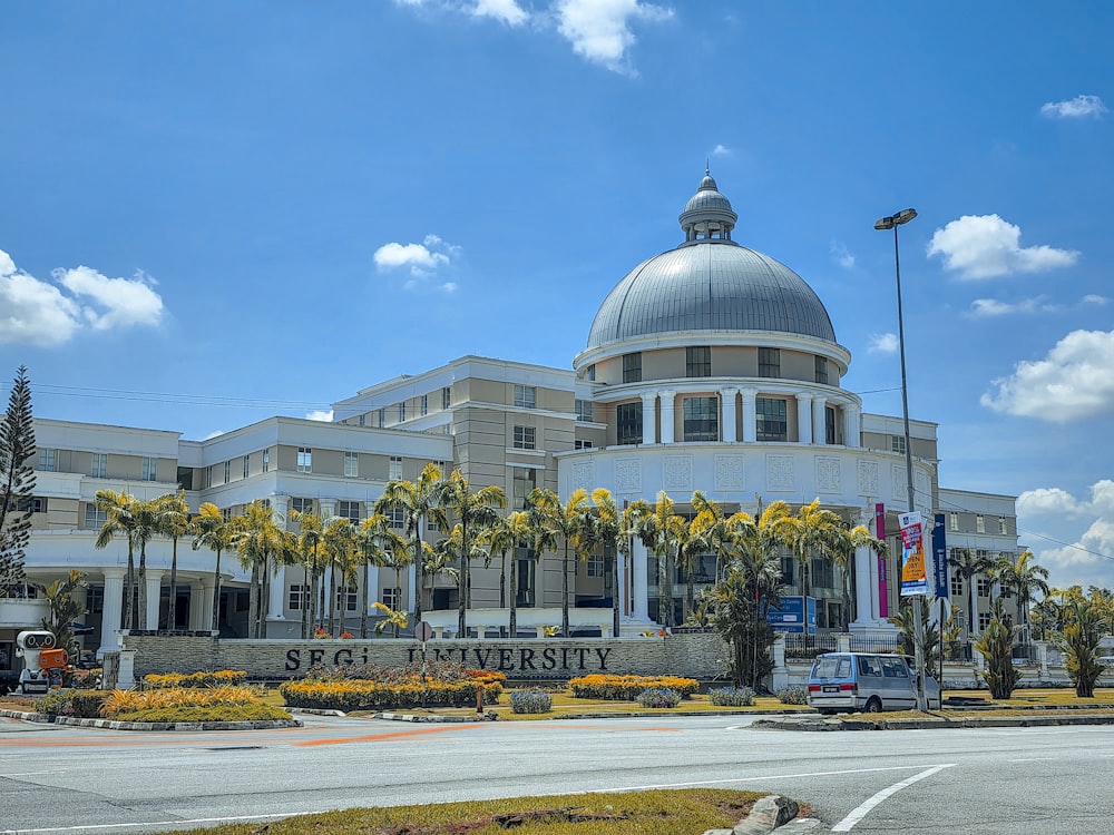 a large white building with a dome