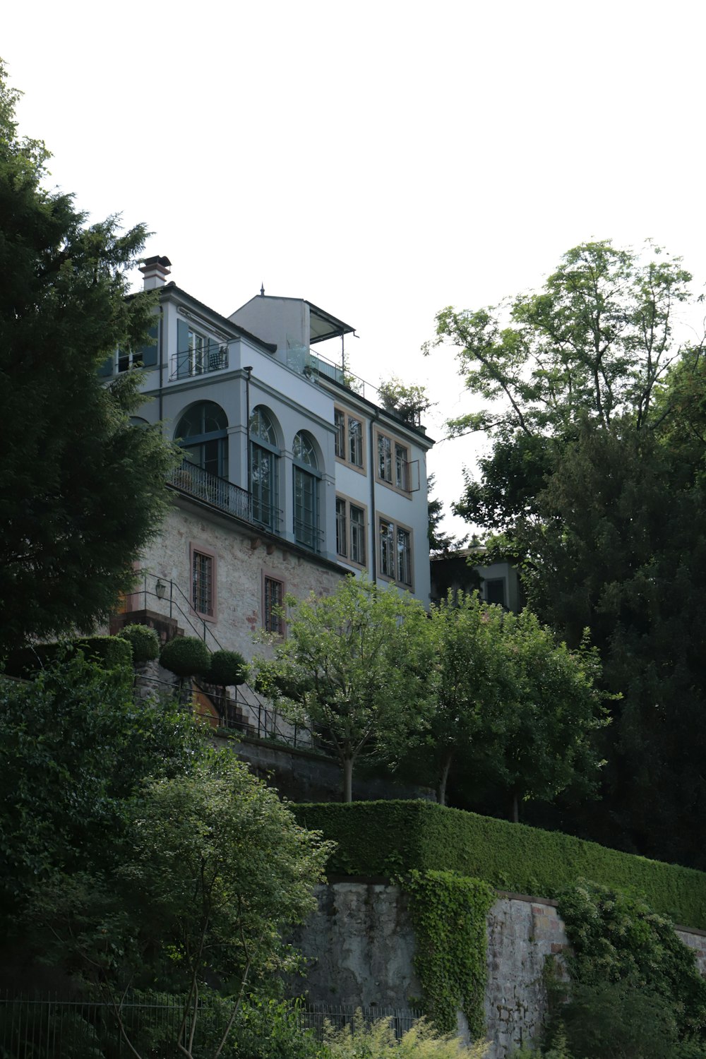 a large building with trees in front of it