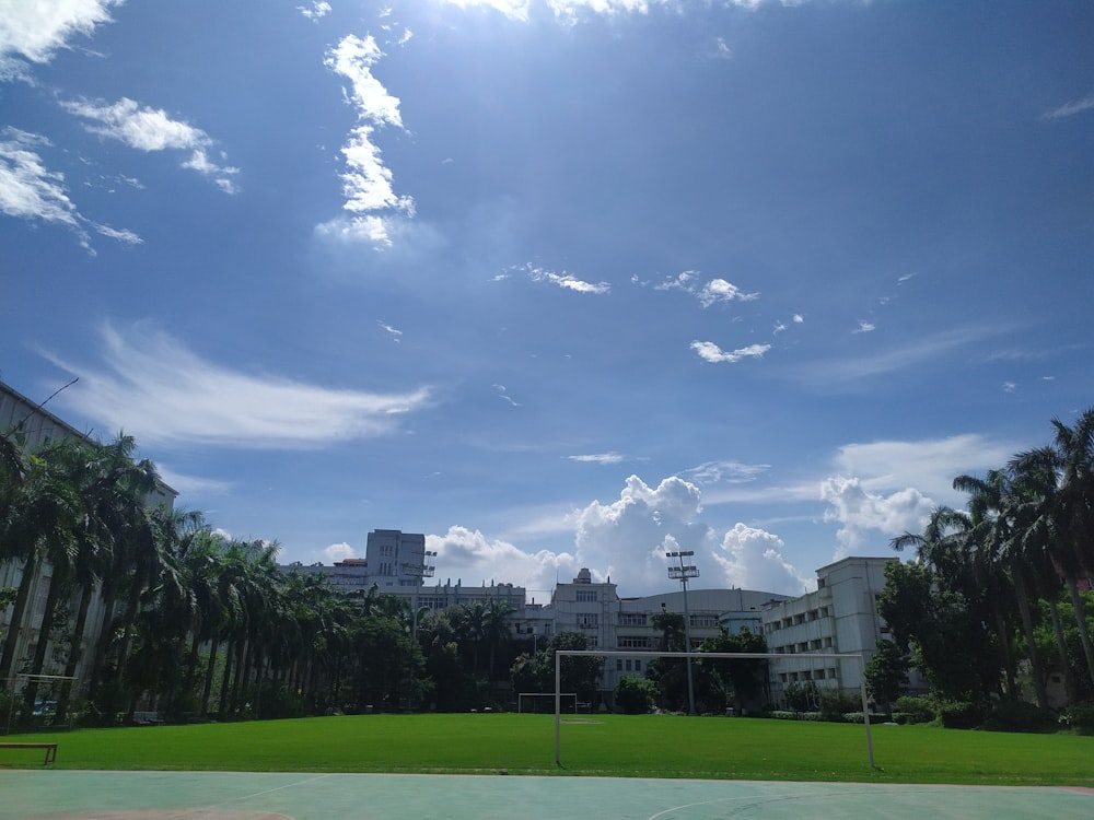 a large building with a green lawn