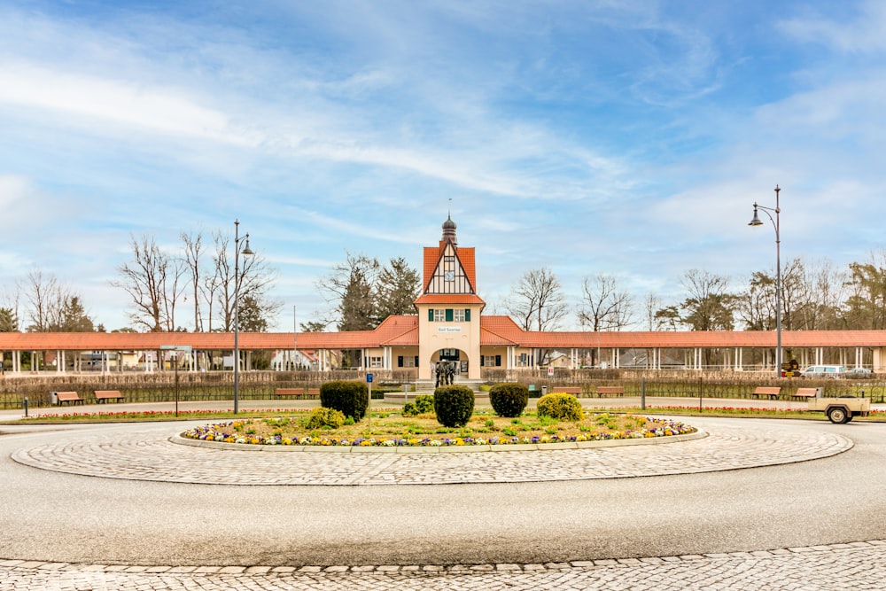 a clock tower in the middle of a road