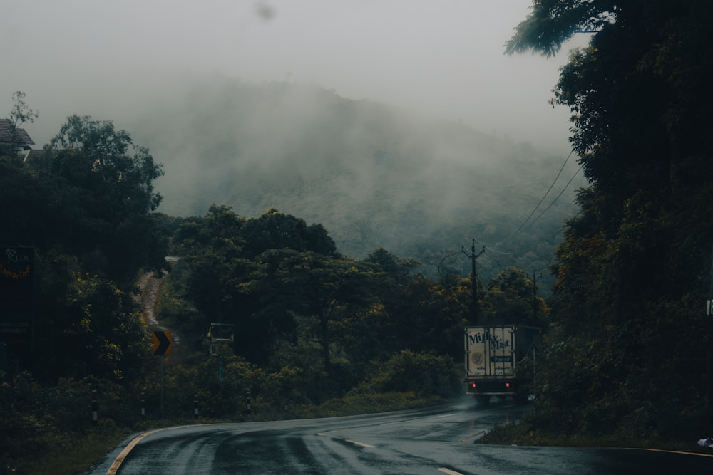 a truck driving down a road