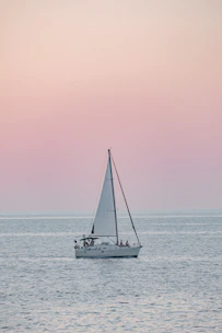 A cozy sunset cruise with warm lights glowing against a pastel sky.