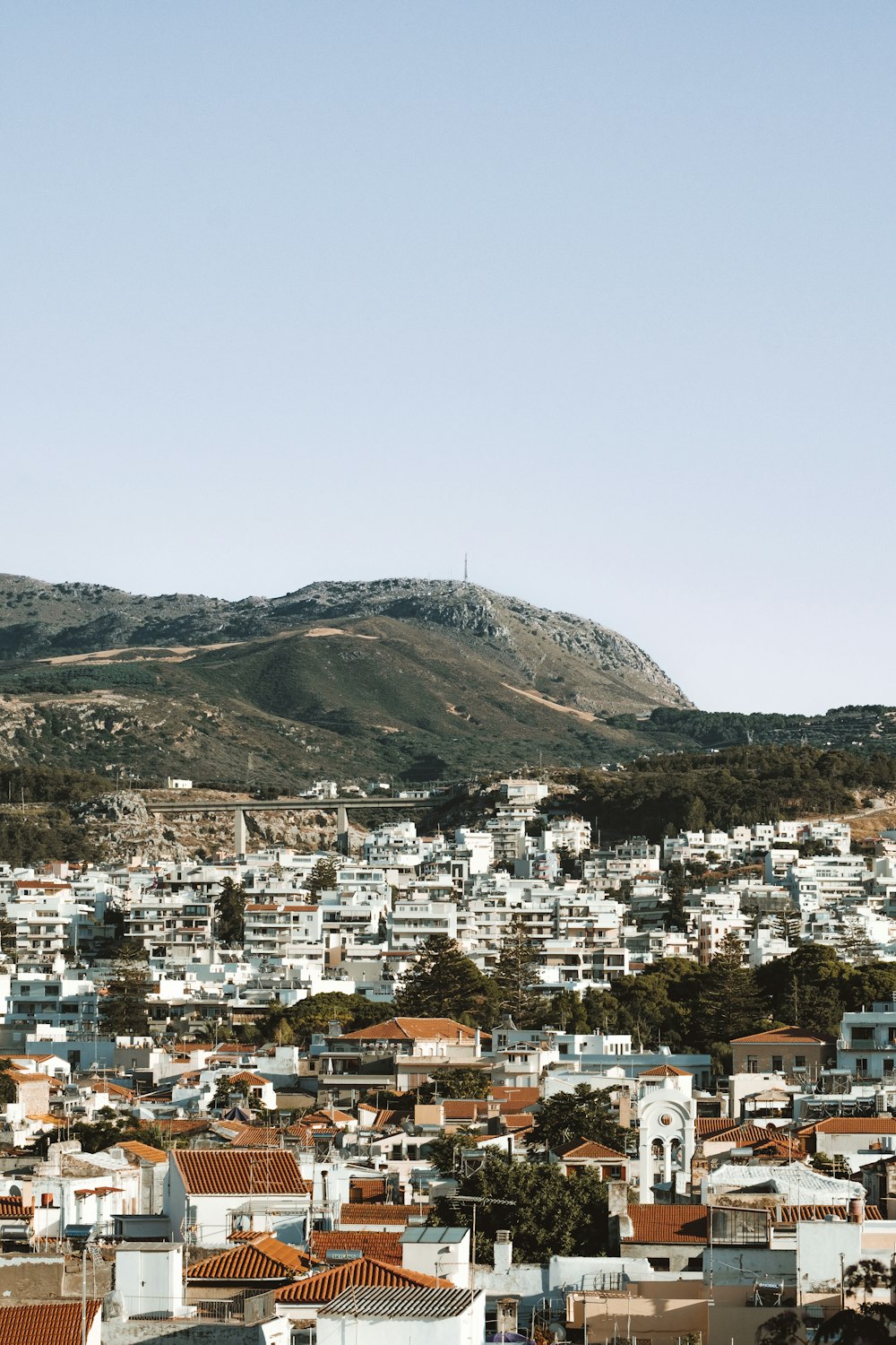 a city with a hill in the background