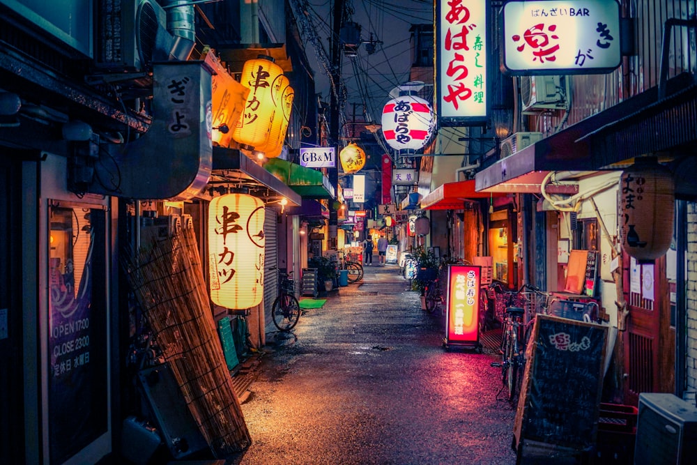 a street with signs and shops