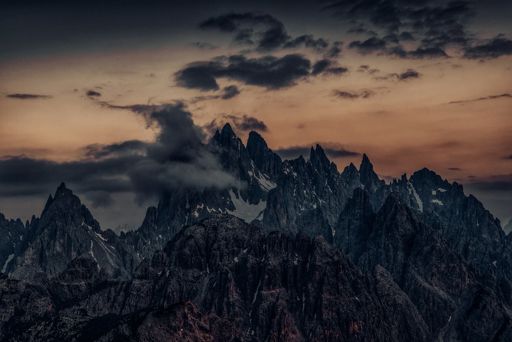 a mountain range with clouds