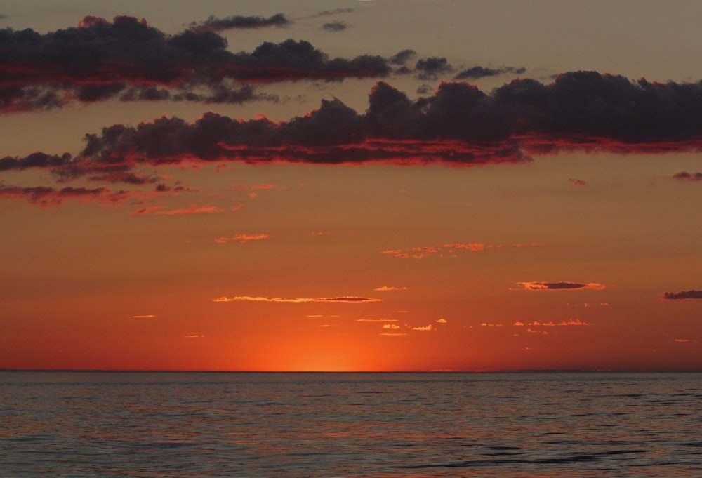 a sunset over a body of water