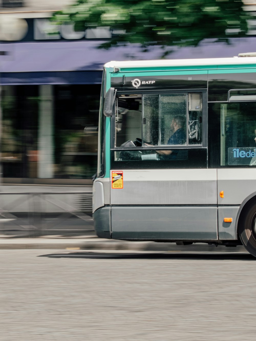 a bus driving down the street