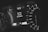 A close-up of a car dashboard displays a speedometer with numbers ranging from 0 to 220. The digital screen shows a temperature of 47°C and a message indicating that the key fob has left the vehicle. The dashboard features sleek, modern design elements with monochrome colors.