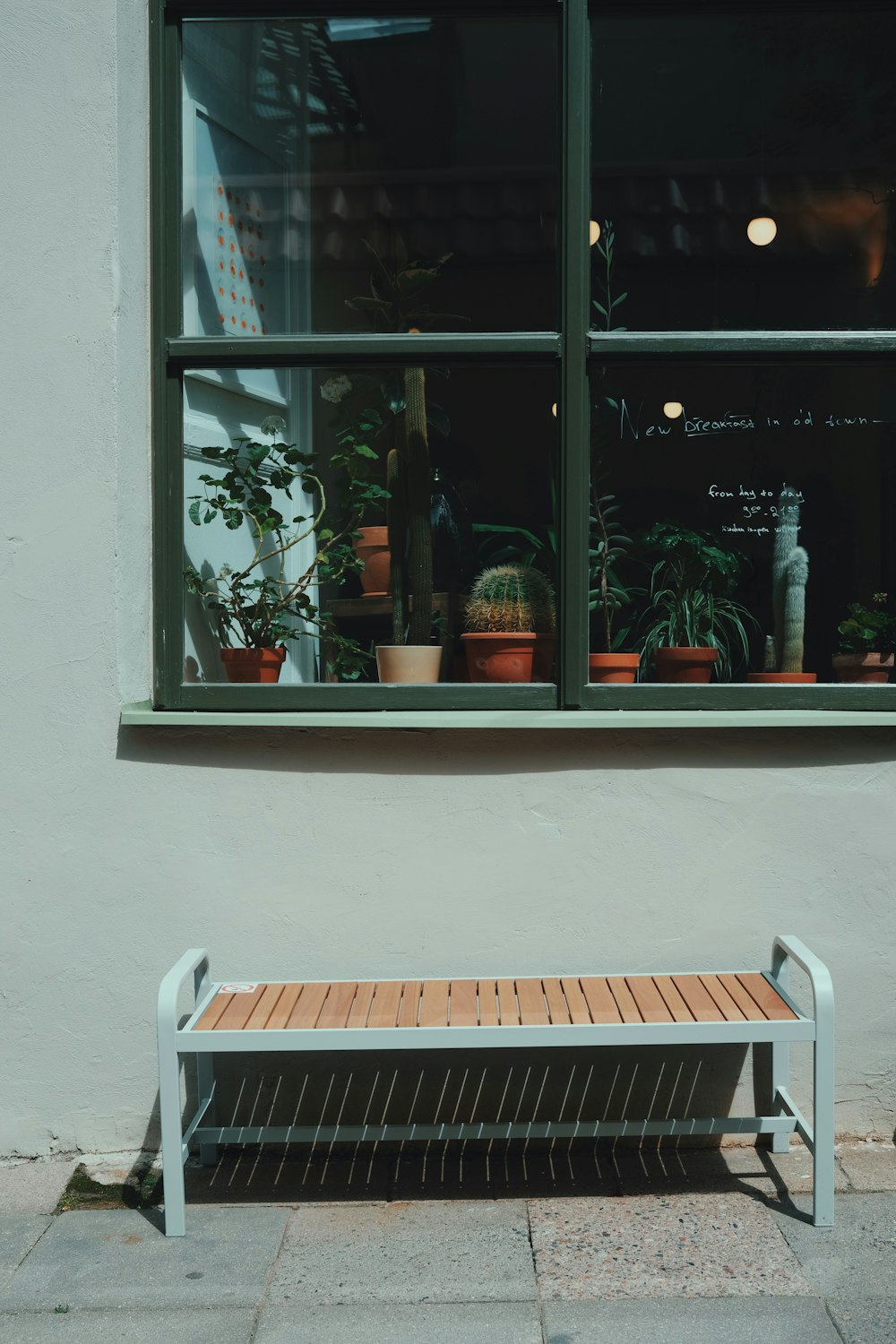 a bench in front of a window