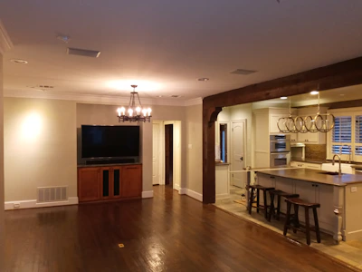Open-concept kitchen expansion with large island and modern appliances.