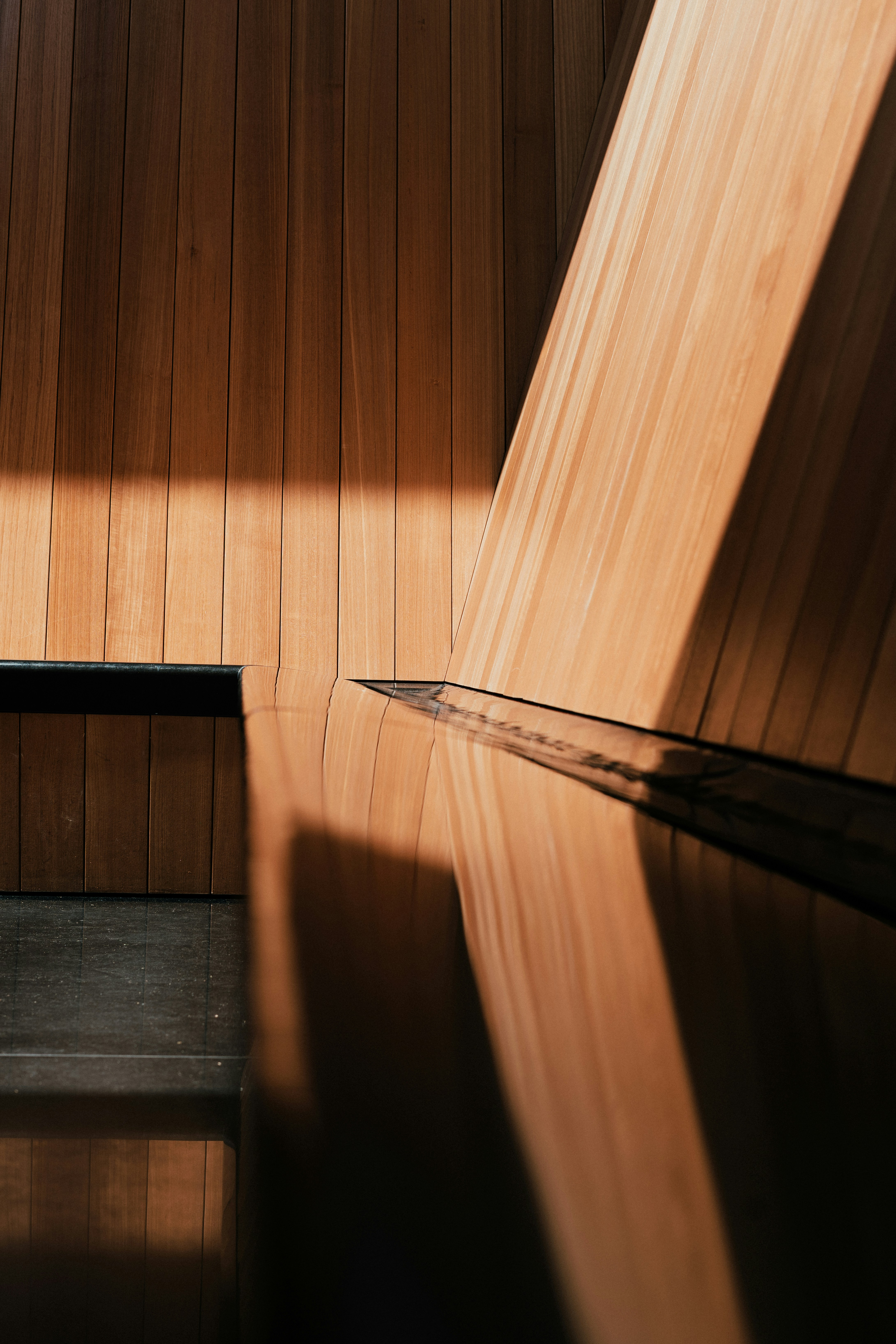 a shadow of a person on a wooden floor