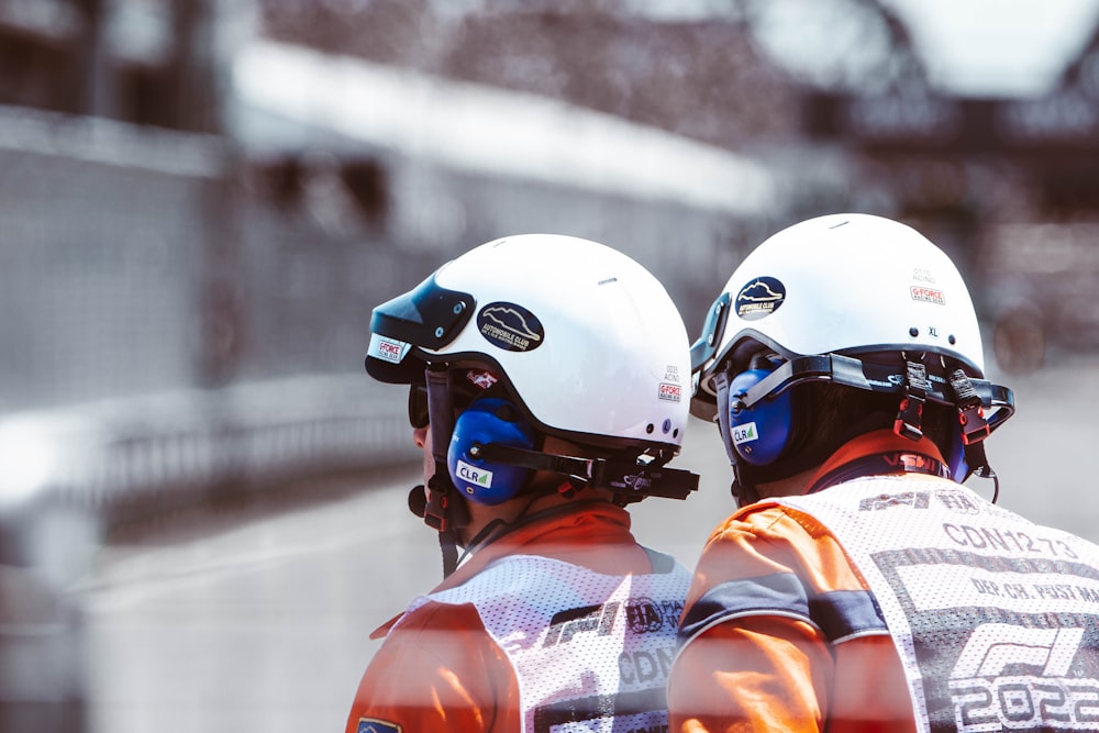 a couple of people wearing helmets