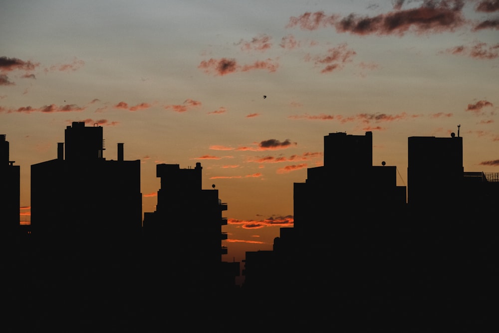 silhouette of a city at sunset