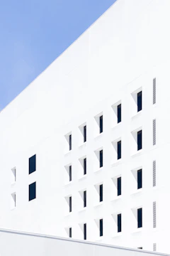 A finished exterior facade showcasing neat edges and a clean white and blue color scheme