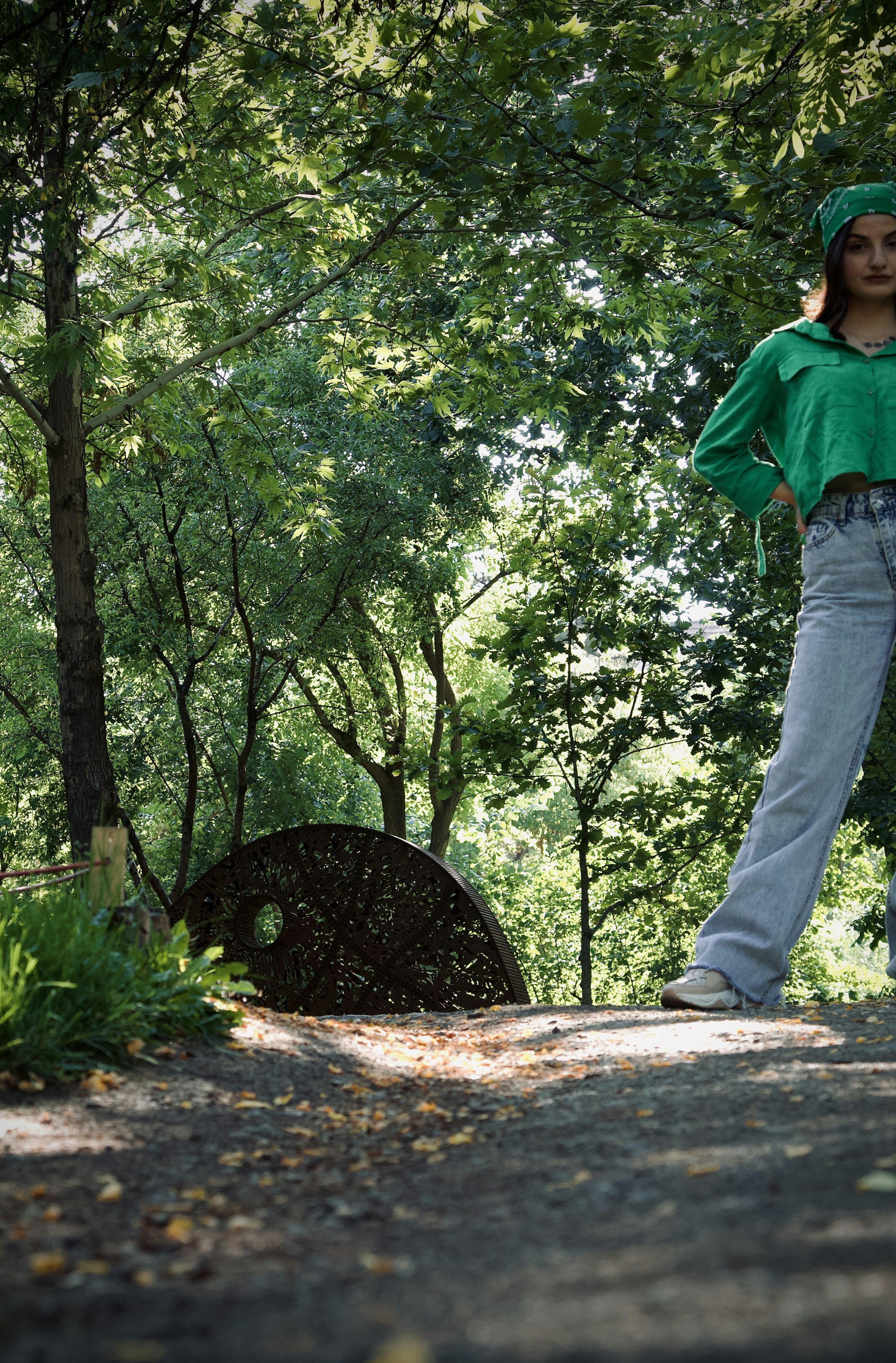 a person standing next to a tunnel
