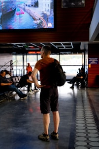 a man standing in front of a screen