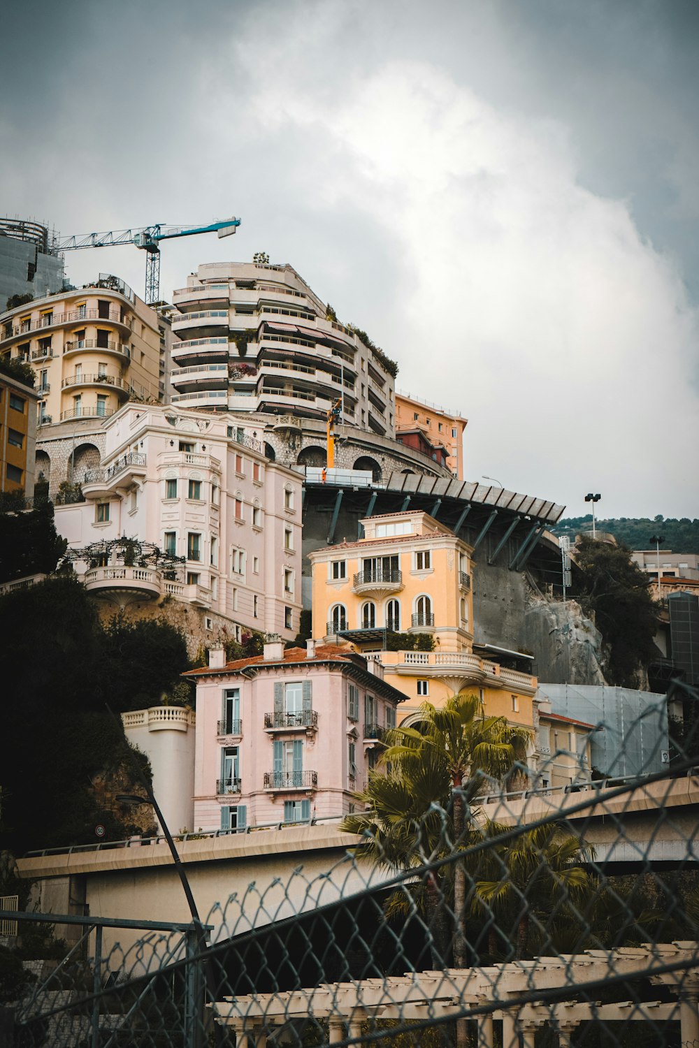 a group of buildings with cranes