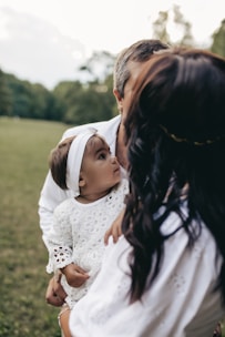 a person holding a baby
