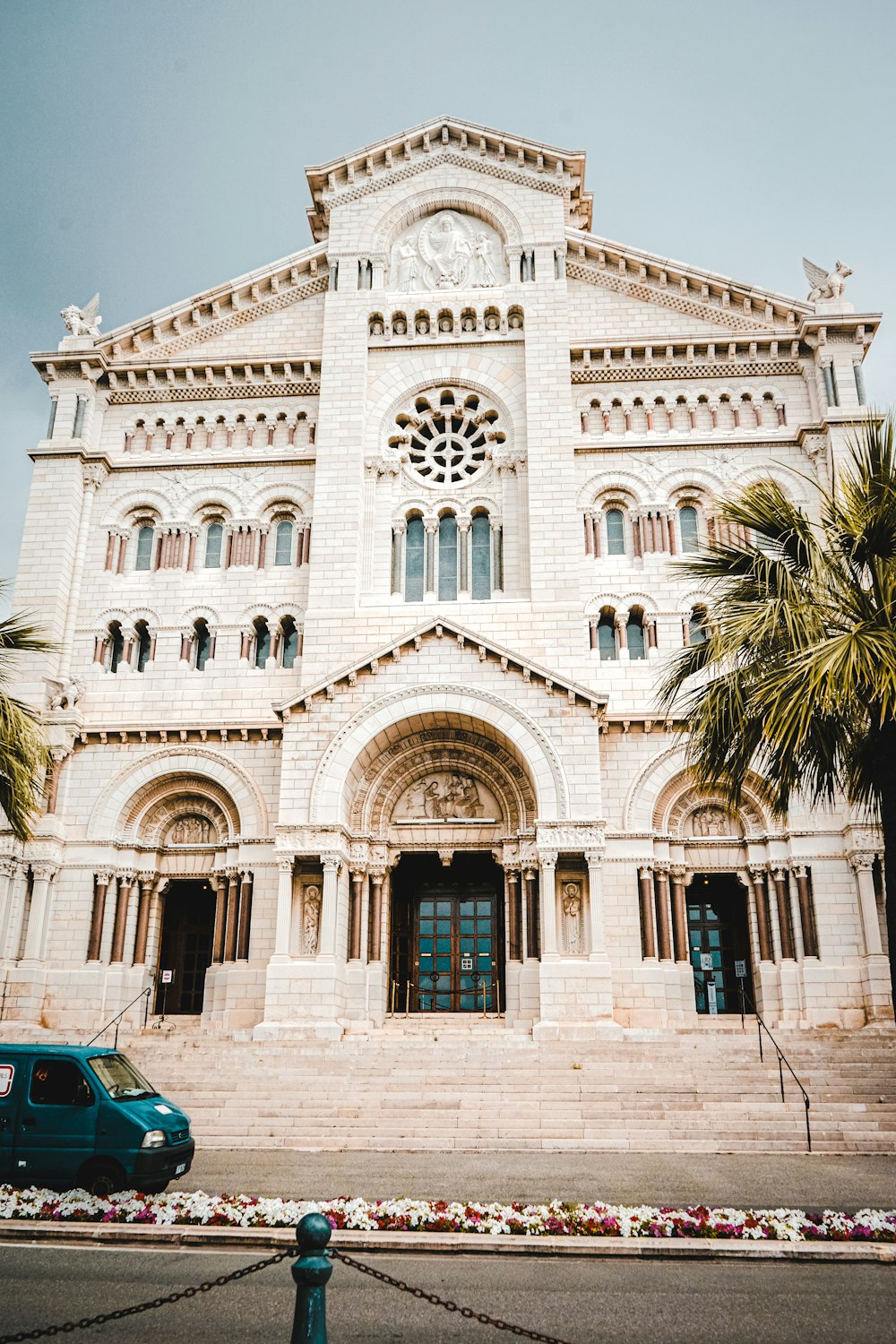 a white building with a large arched doorway