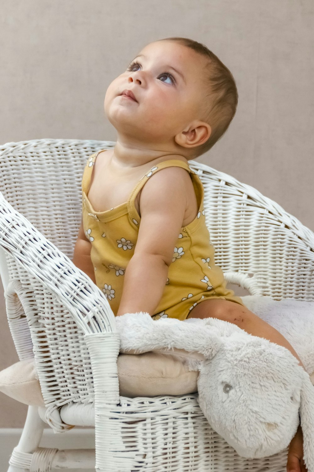 a baby sitting in a chair