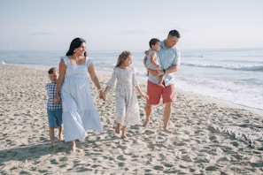a family walking on the beach