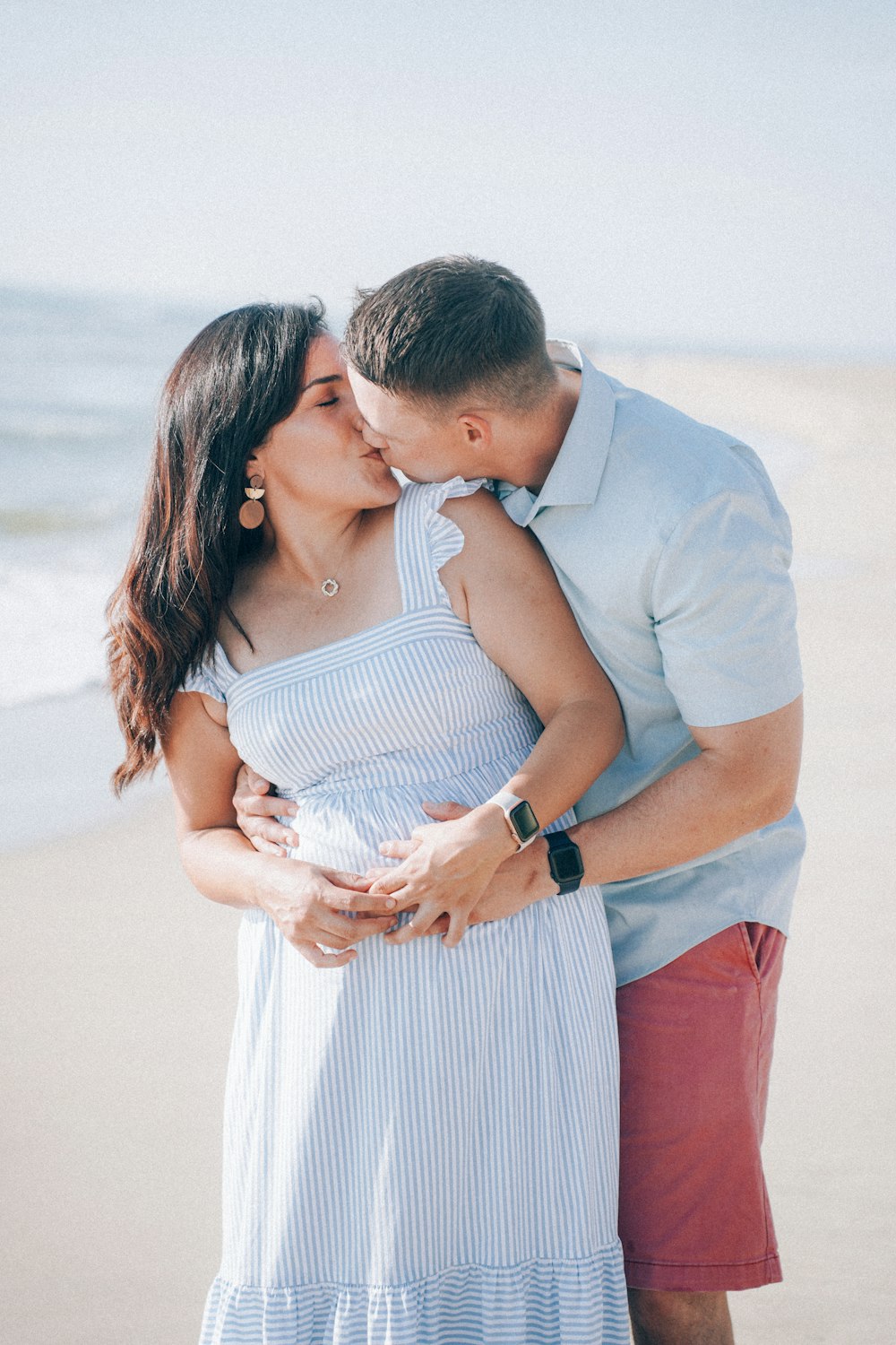 a man and woman kissing