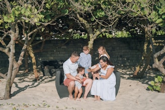 a group of people sitting on a bench