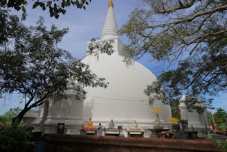 a white temple with a pointed roof