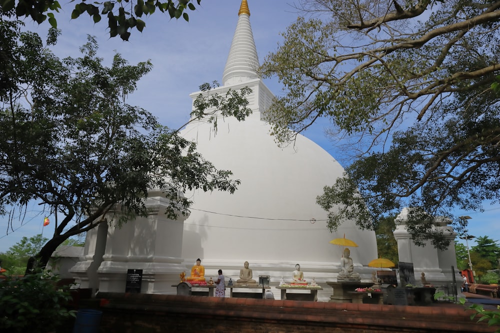 a white temple with a pointed roof
