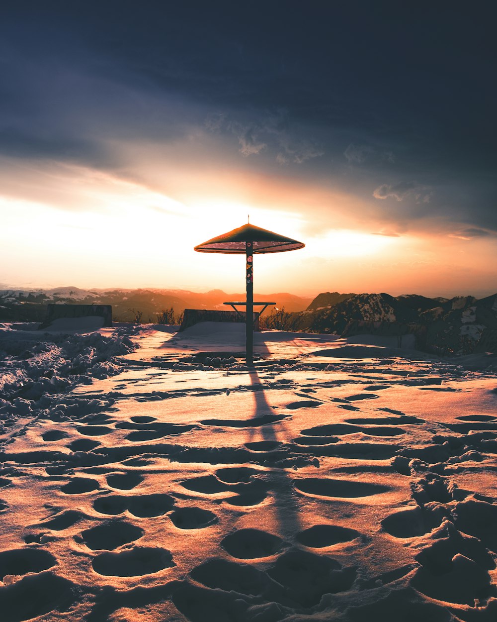 a sunset over a rocky beach