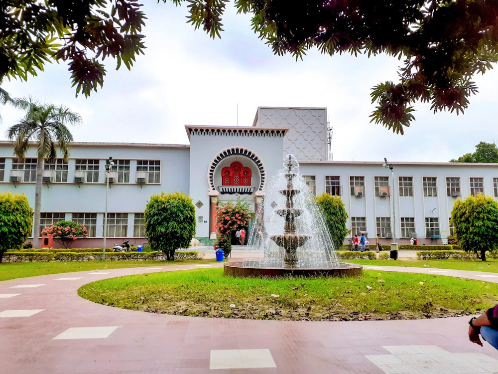 a fountain in front of a building