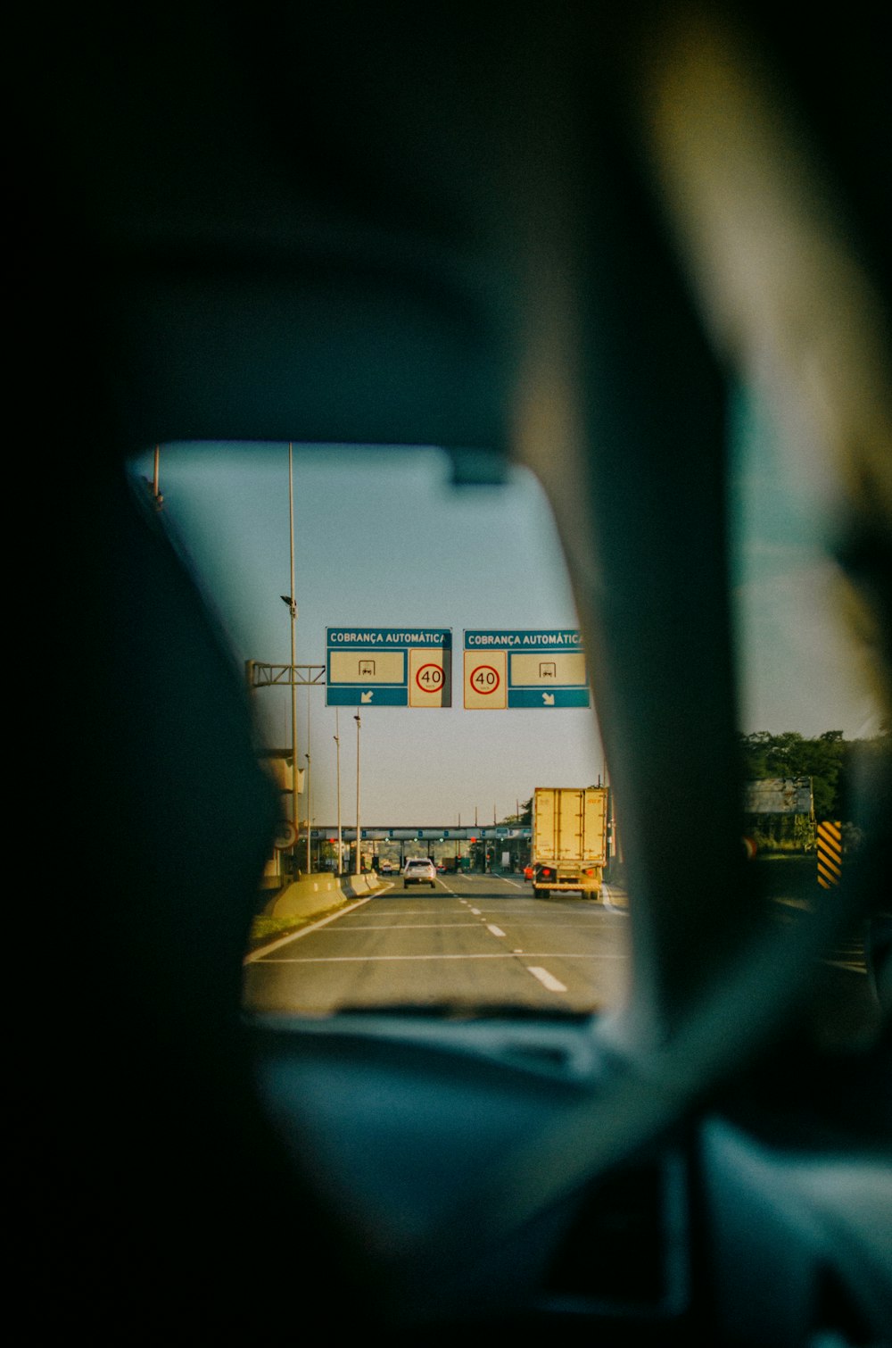 a view of a street through a car window