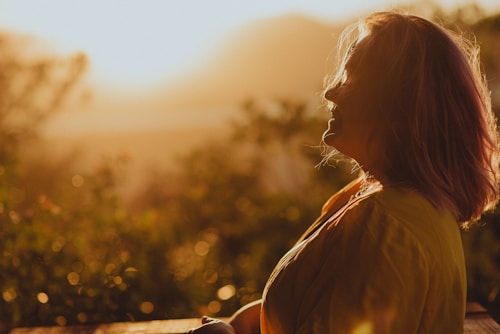 Woman in golden light representing inner awakening
