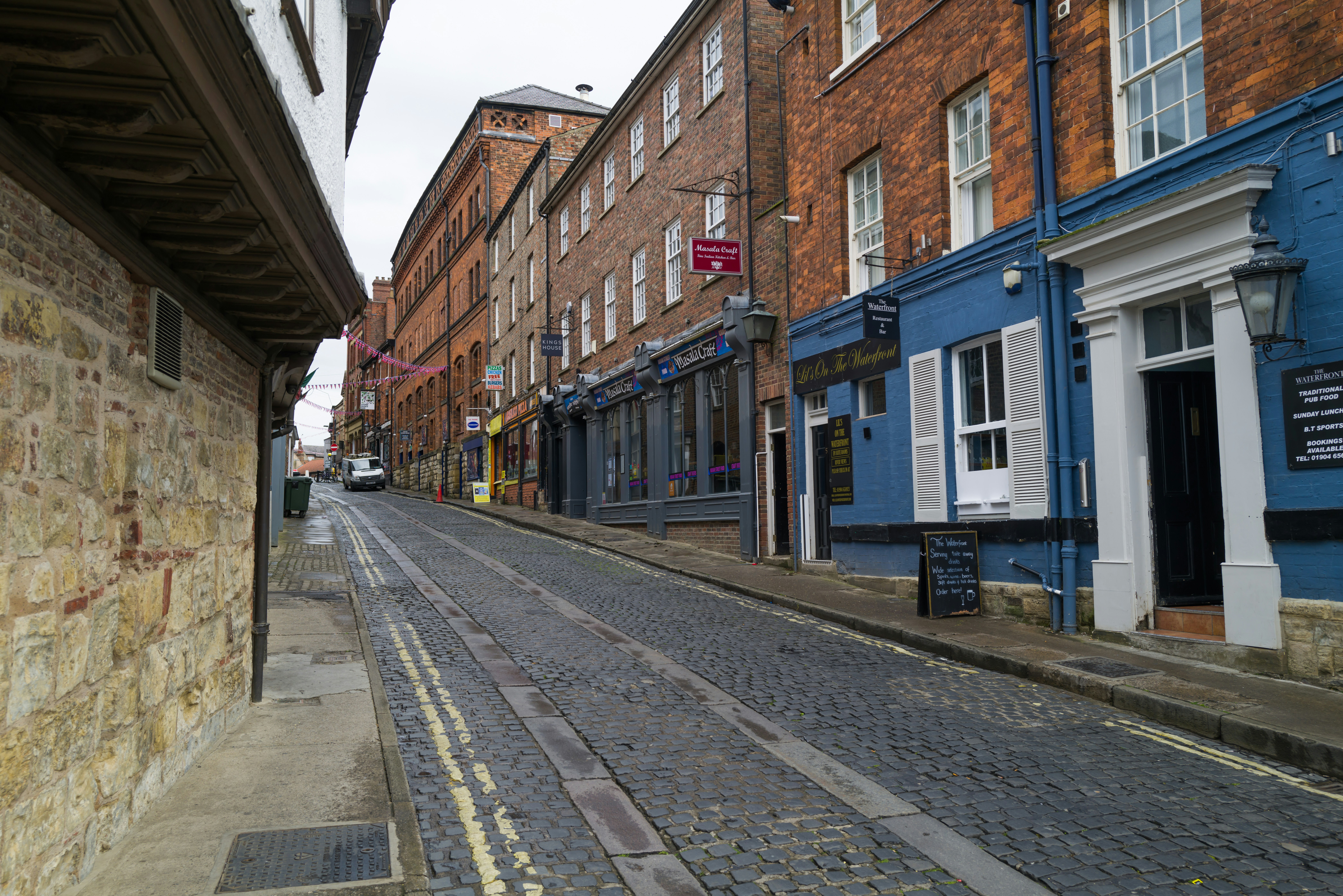 a street with buildings on either side, York - England