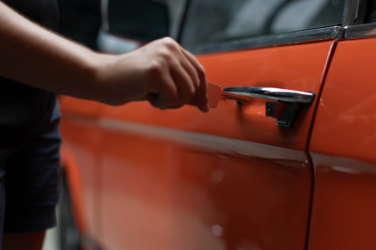 Chauffeur opening the car door for a passenger