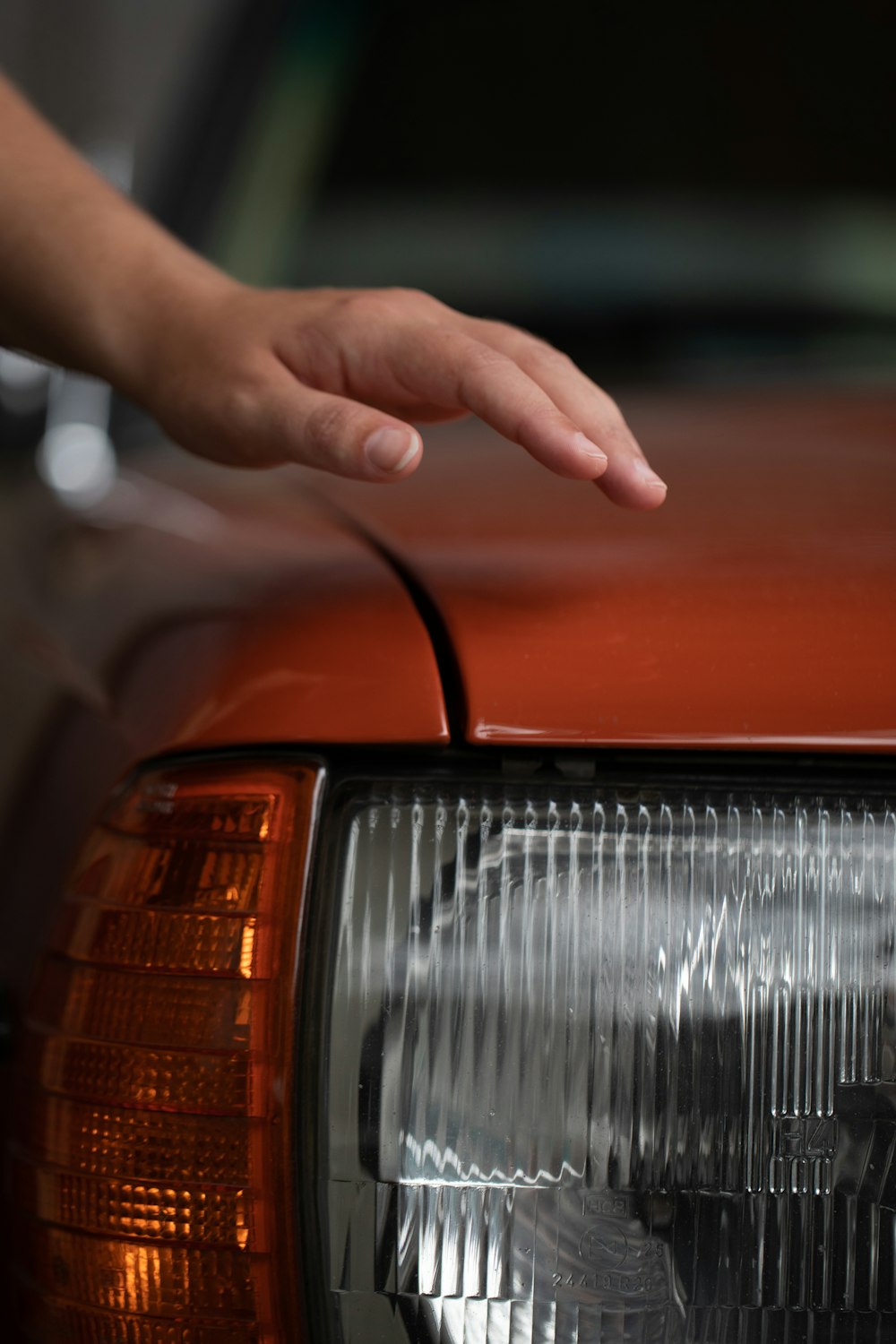 a hand holding a car door