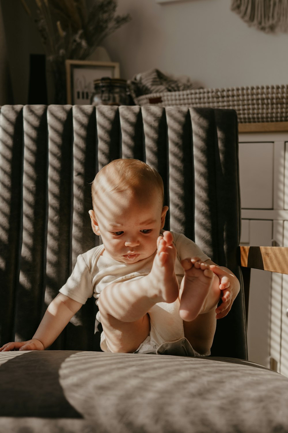 a baby sitting in a chair