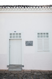 a white building with a sign on it