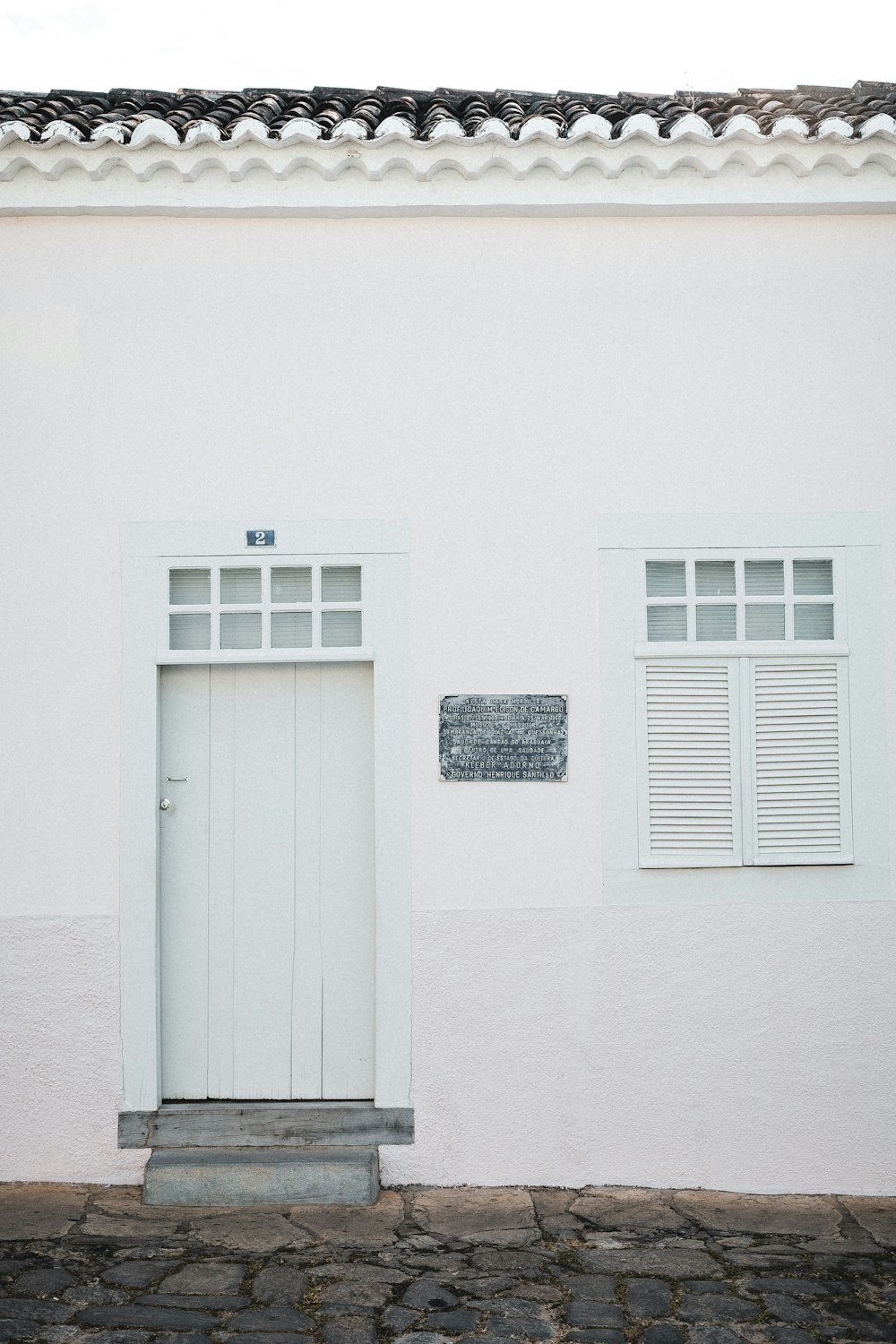 a white building with a sign on it