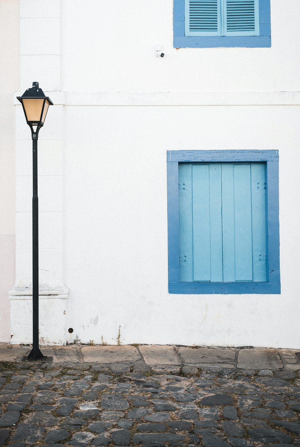 a white building with blue doors