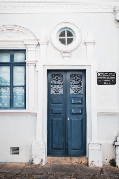 a blue door on a white building