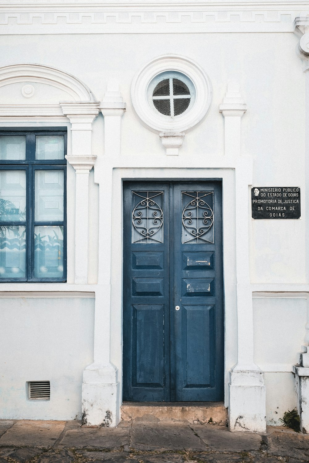 a blue door on a white building