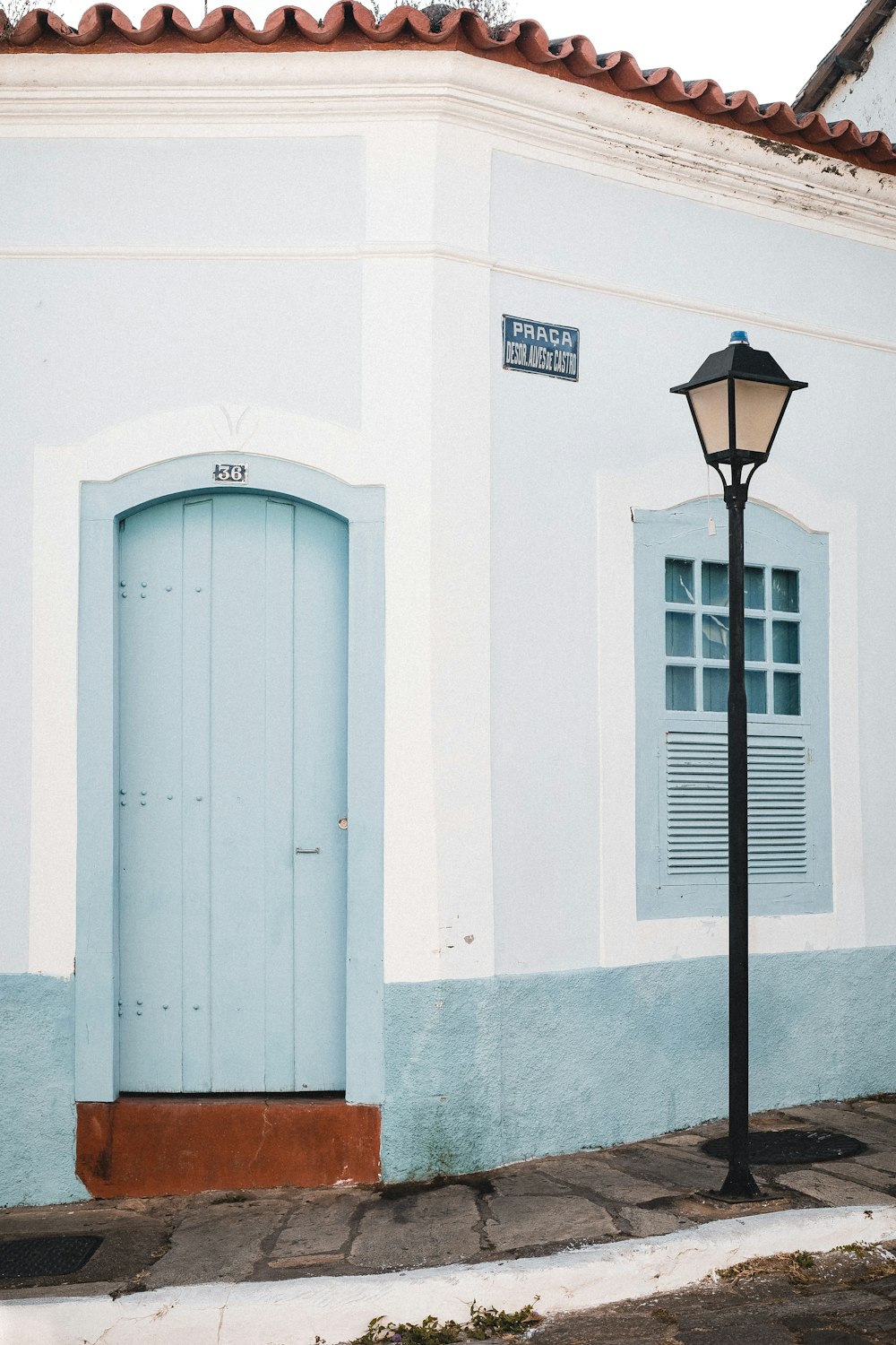 a white building with a blue door