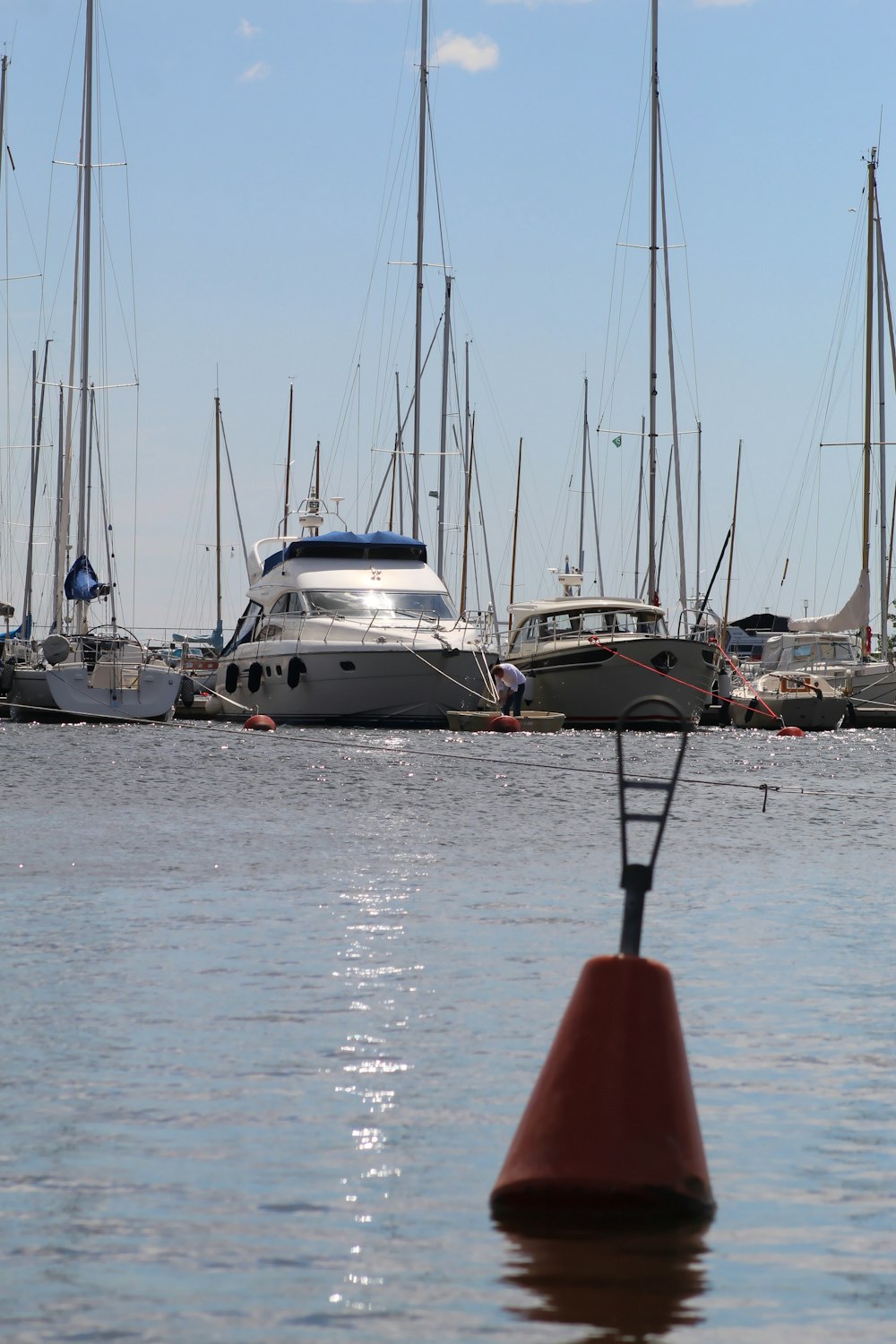 a group of boats sit in a harbor